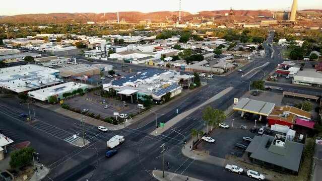 Drone aerial of Mount Isa township and road with cars driving