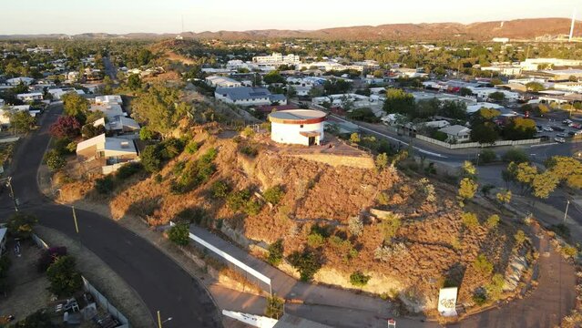 Drone aerial ff Mount Isa moving forward slowly during sunrise