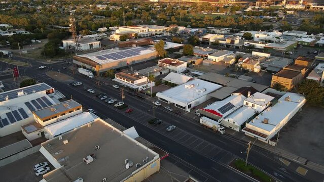 Drone aerial moving forward and pan down of Mount Isa town and solar panels