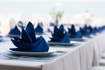 Arrangement of dishes on the prepared table in a hotel or restaurant