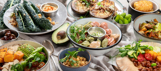 Vegetarian and various vegan dishes on light table. Healthy food concept with vitamins, fiber and antioxidants.