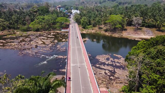 Paved Road Bridge Of Vettilapara Across Chalakkudy River In Thrissur district, Kerala, India. Aerial Drone Shot
