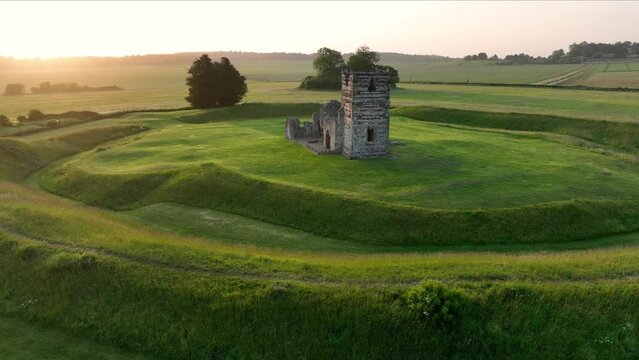 Low level aerial view of Knowlton Church at sunrise, Dorset, England.