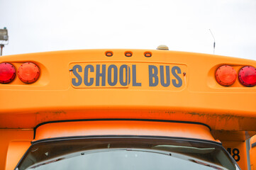 yellow school bus, a symbol of education and childhood nostalgia, waiting to transport students on...