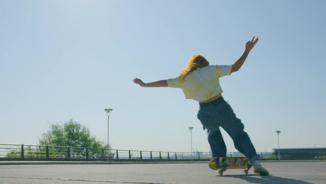 Female Skateboarder fail skateboard trick slow motion. Urban sports. Skateboard