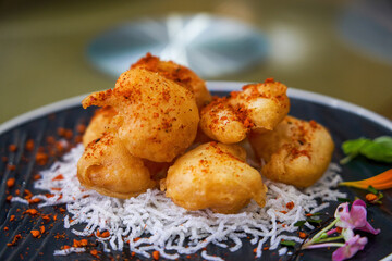 A plate of crispy and delicious fried shrimp balls