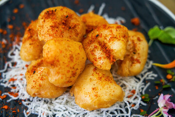 A plate of crispy and delicious fried shrimp balls