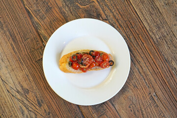 Bruschetta. Cherry tomatoes and olives Bruschetta, vegetarian food. Selective focus