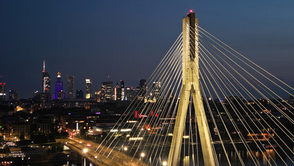 Obraz premium Swietokrzyski bridge on Vistula river in Warsaw at night.