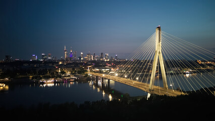 Swietokrzyski bridge on Vistula river in Warsaw at night.