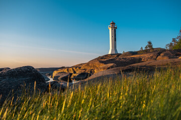 Sea lighthouse on a rocky shore
