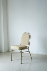 comfotable chair in empty white room. Empty chair at the room corner. loneliness concept