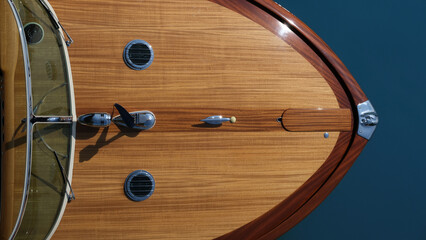Wooden deck on a blue background top view. The front of a wooden boat on a blue background top...