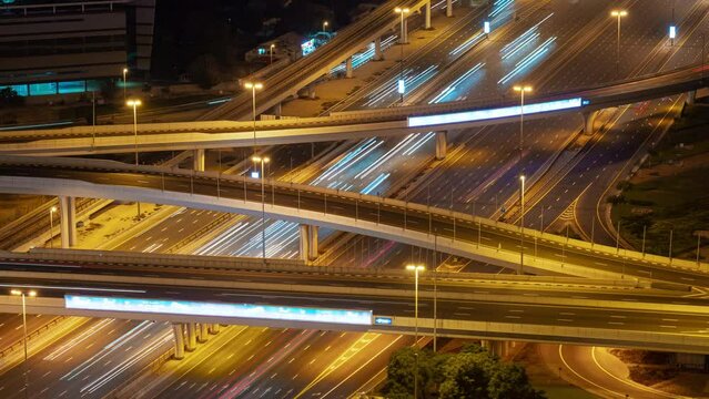 night illuminated dubai city main traffic road interchange rooftop panorama 4k timelapse uae 