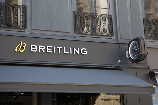 Breitling logo sign entrance and brand text wall store facade boutique Swiss luxury watchmaker shop chain