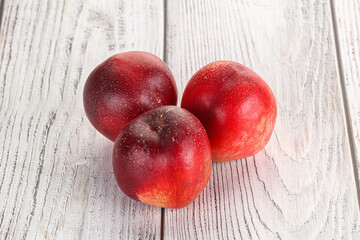 Ripe sweet juicy nectarines heap
