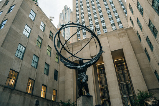 NEW YORK CITY, NY - DEC 2022 Atlas Statue And St. Patrick's Cathedral