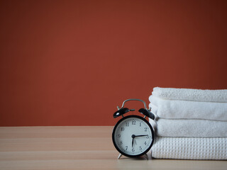 Bathroom set with alarm clock on table