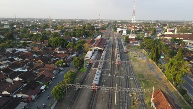 Aerial view of KRL Train in Klaten Train Station in the evening.