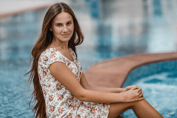 Pretty woman near the pool