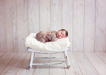 Cute Sleeping Newborn Baby In A Wooden Basket On Wood Background. Close up