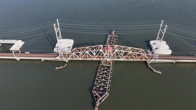 Sideways panning view of old River Draw Bridge over the Raritan River in NJ