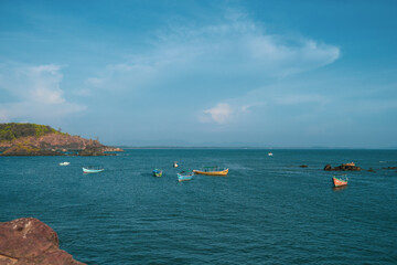 Fototapeta na wymiar Beach View - Boats and mountains - Gokarna, Tamilnadu, India