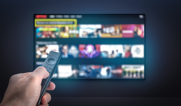 Streaming service. Watching online TV. Multimedia Television video streaming, choosing film to watch with remote. Subscription Streaming video. Internet streaming service concept. TV VOD service