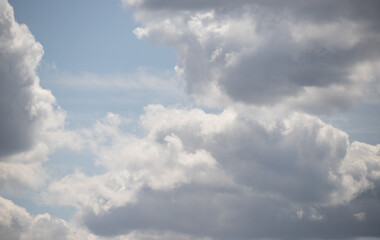 Fototapeta na wymiar White cumulus clouds against the blue sky