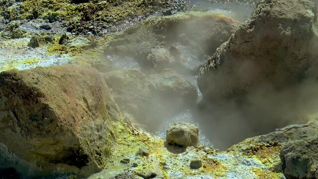 Slow motion footage of hot springs, steaming fumaroles and boiling mud pots in Seltun Geothermal Area (Seltúnshverir or Krýsuvíkurhverir) in Iceland