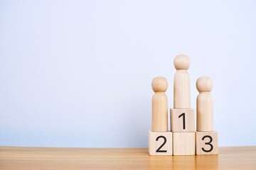 Wooden blocks stacked as a platform on a white background. Success or ranking ideas.