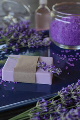 Obraz na płótnie Canvas Handmade lavender soap with natural fresh lavender flowers. Side view.