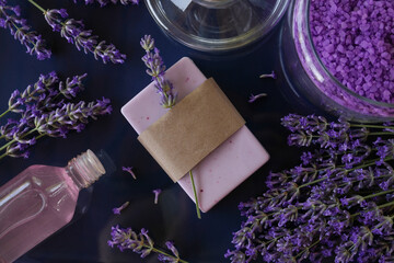 Lavender spa. Essential oils, sea salt and handmade soap. Natural herb cosmetic with lavender flowers.Healthy skin care. SPA concept. Top view, flat lay.