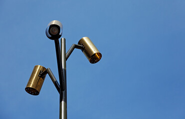 bronze street lamp with three light sources