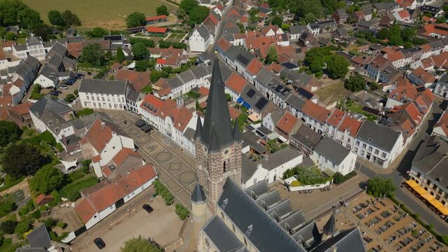 Drone shot over the idyllic town of Thorn in the municipality of Maasgouw, Limburg with view of the church tower with historic buildings in durch architecture