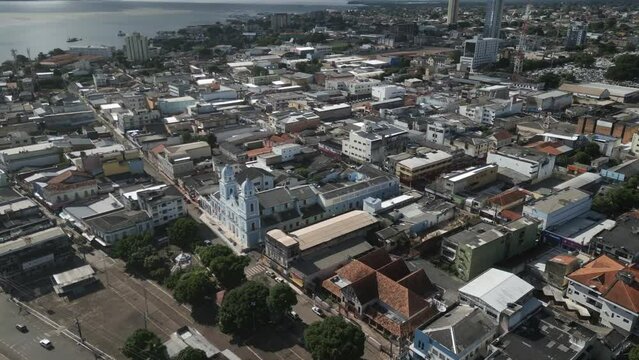 Aerial over the city of Santar&eacute;m, State of Par&aacute;, Brazil, drone fly above blue church colonial style in amazon river rainforest
