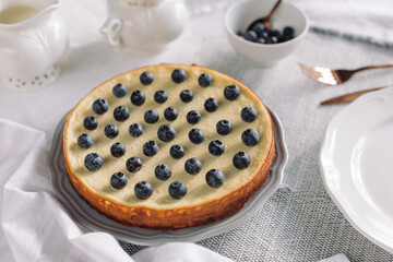 Low-carb dessert for diabetics. Pie made of cottage cheese, almond flour, eggs, ricotta, stevia and decorated with blueberries.