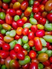 Fototapeta na wymiar Green and red tomatoes. small tomatoes.