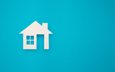 Property investment and house mortgage financial. House symbol on a blue background