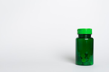 Plastic bottle for vitamins on color background