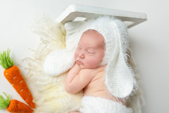 portrait of a newborn baby in a hare hat. Life style. first photo session of a newborn. a little boy