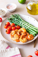 Fried shrimp with asparagus and tomatoes. Healthy eating. Diet.