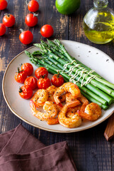 Fried shrimp with asparagus and tomatoes. Healthy eating. Diet.