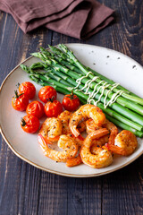 Fried shrimp with asparagus and tomatoes. Healthy eating. Diet.