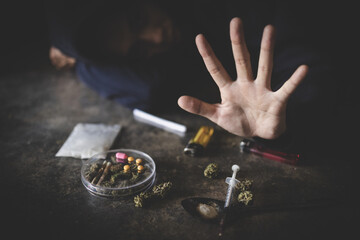 Human hands on dark background, Stop drug addiction concept, Do not interfere with drugs,...