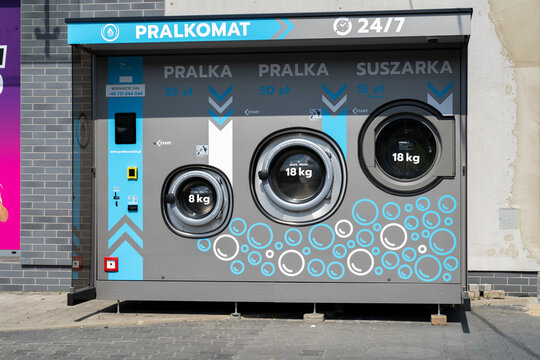 Pralkomat self-service laundry in Poland. Outdoor launderette washing machines and dryers for public use. Laundromat for washing and drying clothes on June 18, 2023 in Trzebinia, Poland.