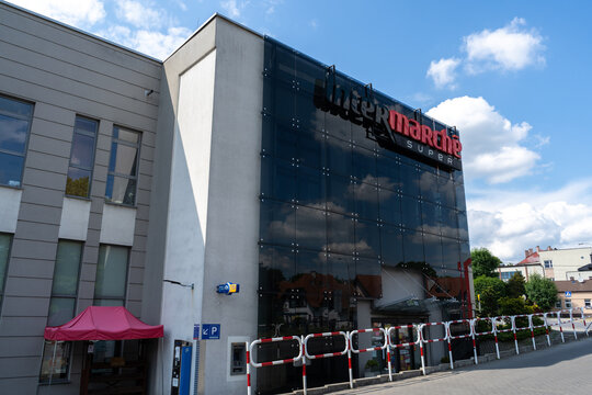 Intermarch&eacute; store with logo sign. French commercial supermarket chain shop, part of the Les Mousquetaires retail group. Hypermarket signboard with brand logotype on June 18, 2023 in Trzebinia, Poland.