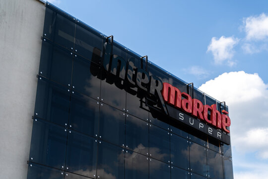 Intermarch&eacute; store with logo sign. French commercial supermarket chain shop, part of the Les Mousquetaires retail group. Hypermarket signboard with brand logotype on June 18, 2023 in Trzebinia, Poland.