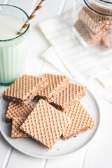 Sweet chocolate wafer on plate.