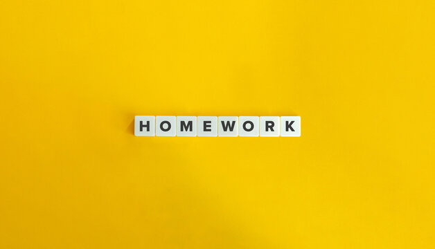 Homework Work on Block Letter Tiles on Yellow Background. Minimal Aesthetic.